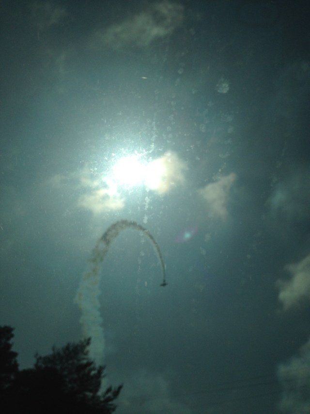 stunt plane with trail