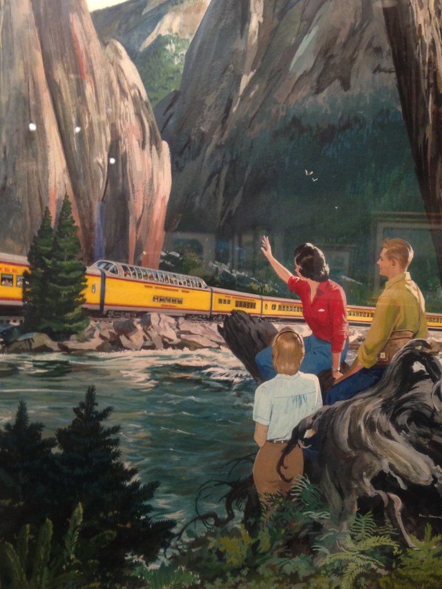 Trio waving to passing train, Milwaukee Road exhibit, Grohmann Museum, 2015