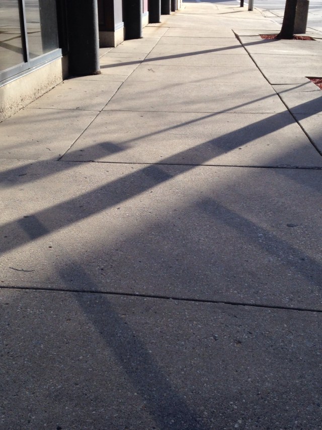 shadow and light pattern on sidewalk