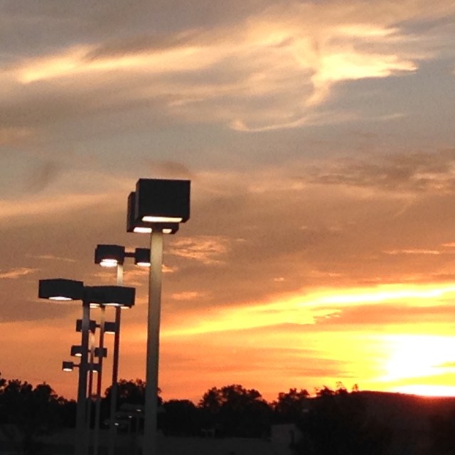 sunset and parking lot lights