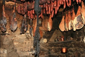 Meats hanging in a smokehouse