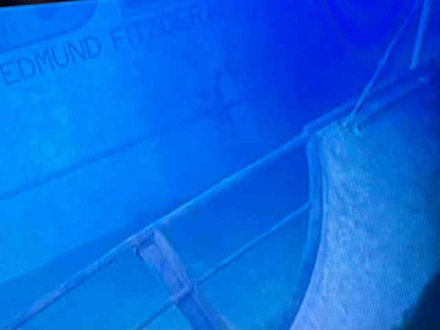 underwater image of the sunken Edmund Fitzgerald, with the name of the ship visible