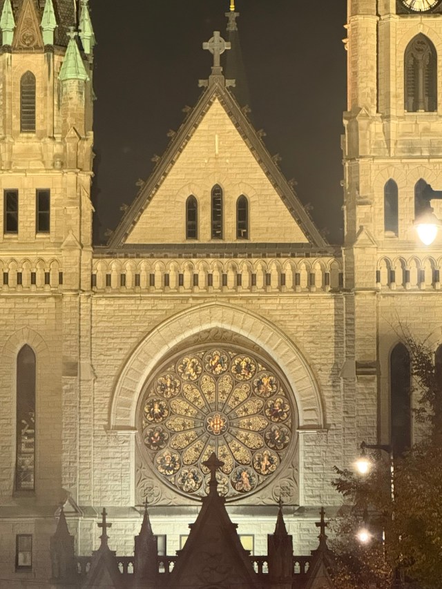 Nighttime image of the Rose Window, lit from within, Church of the Gesu, Milwaukee