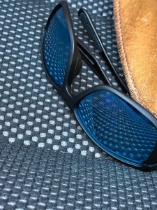 Sunglasses reflecting car seat "polka dot" pattern